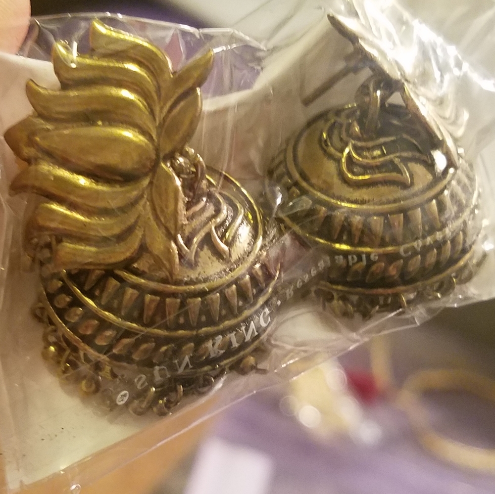 Golden pair of earrings for Indian celebration